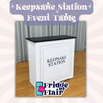 White event table with black top labeled 'Keepsake Station' by Fridge Flair.